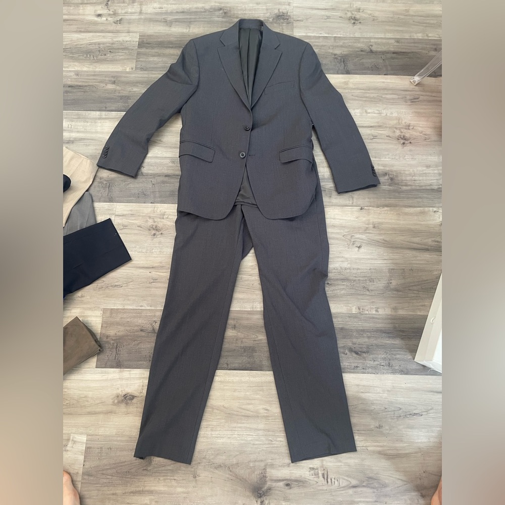 Gray MK modern fit suit. Light water stain on left shoulder. Size 40R